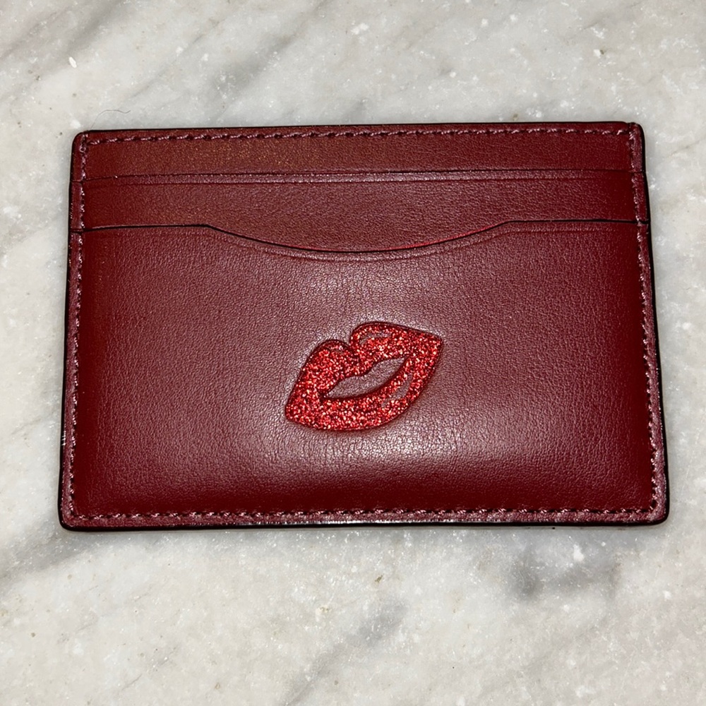 NWT Coach Card Case. Red leather with red glitter lips detailing.